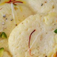 Rasmalai · A Bengali dessert consisting of soft paneer balls immersed in chilled condensed milk flavore...