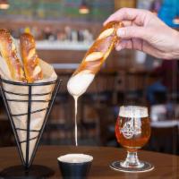 Pretzels & Beer Cheese · Soft, warm Bavarian pretzel sticks brushed with butter and sprinkled with sea salt. Served w...