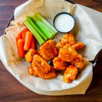 Wings · Crispy wings tossed in your choice of buffalo, Sriracha chili bourbon, BBQ, spicy Thai or Al...