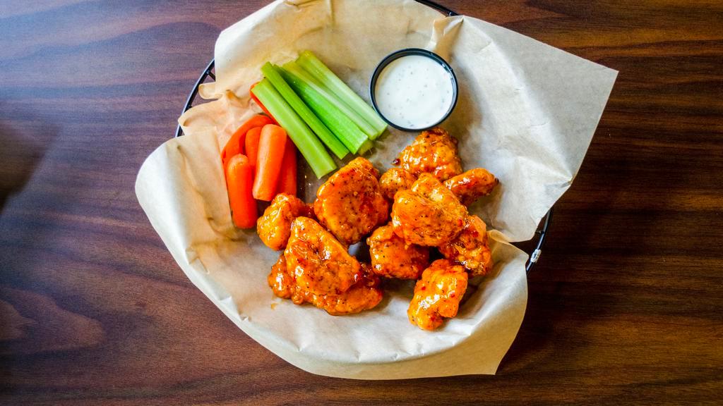 Wings · Crispy wings tossed in your choice of buffalo, Sriracha chili bourbon, BBQ, spicy Thai or Alabama white sauce. Includes ranch or blue cheese for dipping. Served with celery and carrots (upon request).