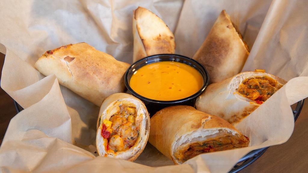 Southwest Egg Rolls · Hot and spicy egg rolls with chicken, cheese, black beans, corn and jalapeños - served with Boom Boom sauce.