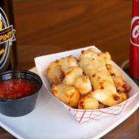 Cheese Curds · Breaded Wisconsin white cheese curds with your choice of ketchup, marinara, or ranch for dip...