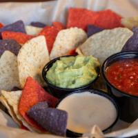 Chips & Dip Trio · Warm tortilla chips, housemade beer cheese, salsa, and guacamole.