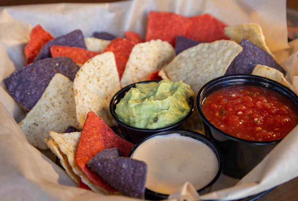 Chips & Dip Trio · Warm tortilla chips, housemade beer cheese, salsa, and guacamole.