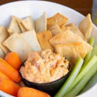 Pimento Cheese · Creamy and spicy pimento cheese served with crackers, celery and carrots.