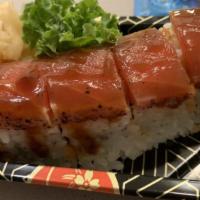 Manhattan · Spicy tuna and crunch roll topped with tuna tataki and eel sauce.