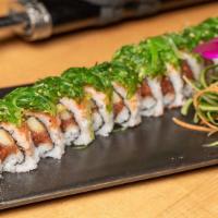 Mermaid Roll · Rolled with spicy tuna, avocado, and cucumber. Topped with masago and seaweed salad.