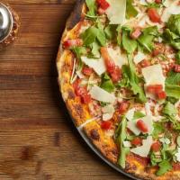 Moderna · Topped with fresh arugula, diced tomatoes, and shaved grana padano cheese. Thin crust with t...