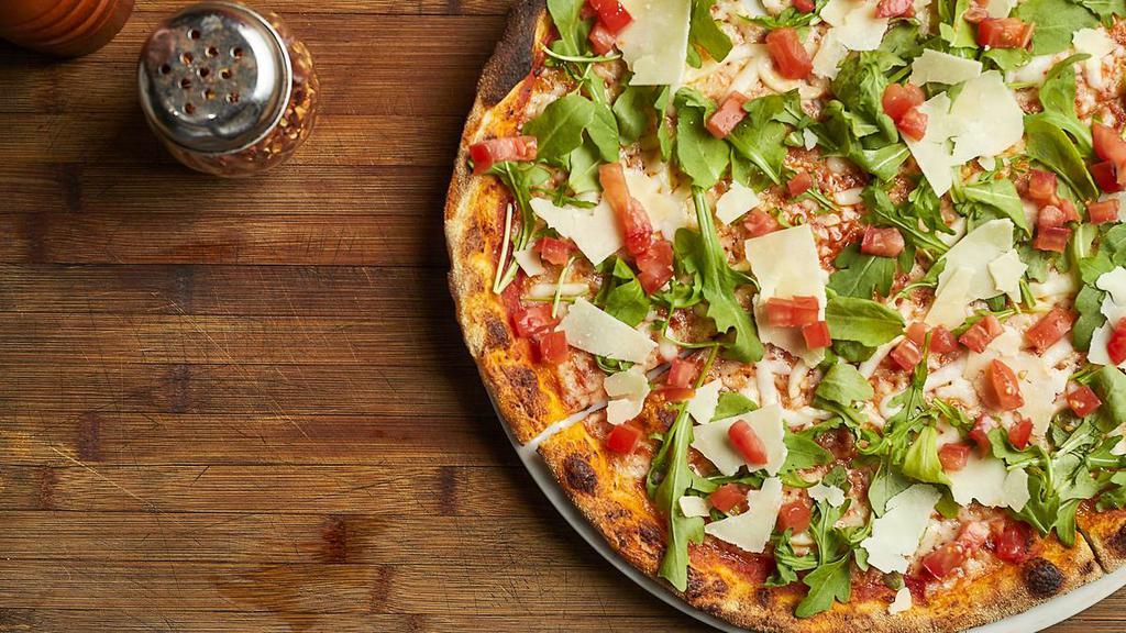 Moderna · Topped with fresh arugula, diced tomatoes, and shaved grana padano cheese. Thin crust with tomato sauce and mozzarella.