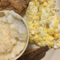Pork Chop At Breakfast Platter · Southern battered pork chop or grilled, eggs any style, grits, and toast.