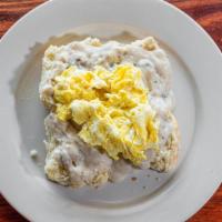 Country Scrambler · Two fresh baked biscuits, topped with savory country gravy and two eggs cooked to order.