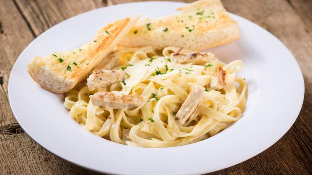 Fettuccine Alfredo With Crispy Chicken · Fettuccine noodles and crispy chicken tossed in a rich, creamy alfredo sauce made with Asiago and romano cheeses with a hint of garlic and fresh parsley. 1860 Cal.