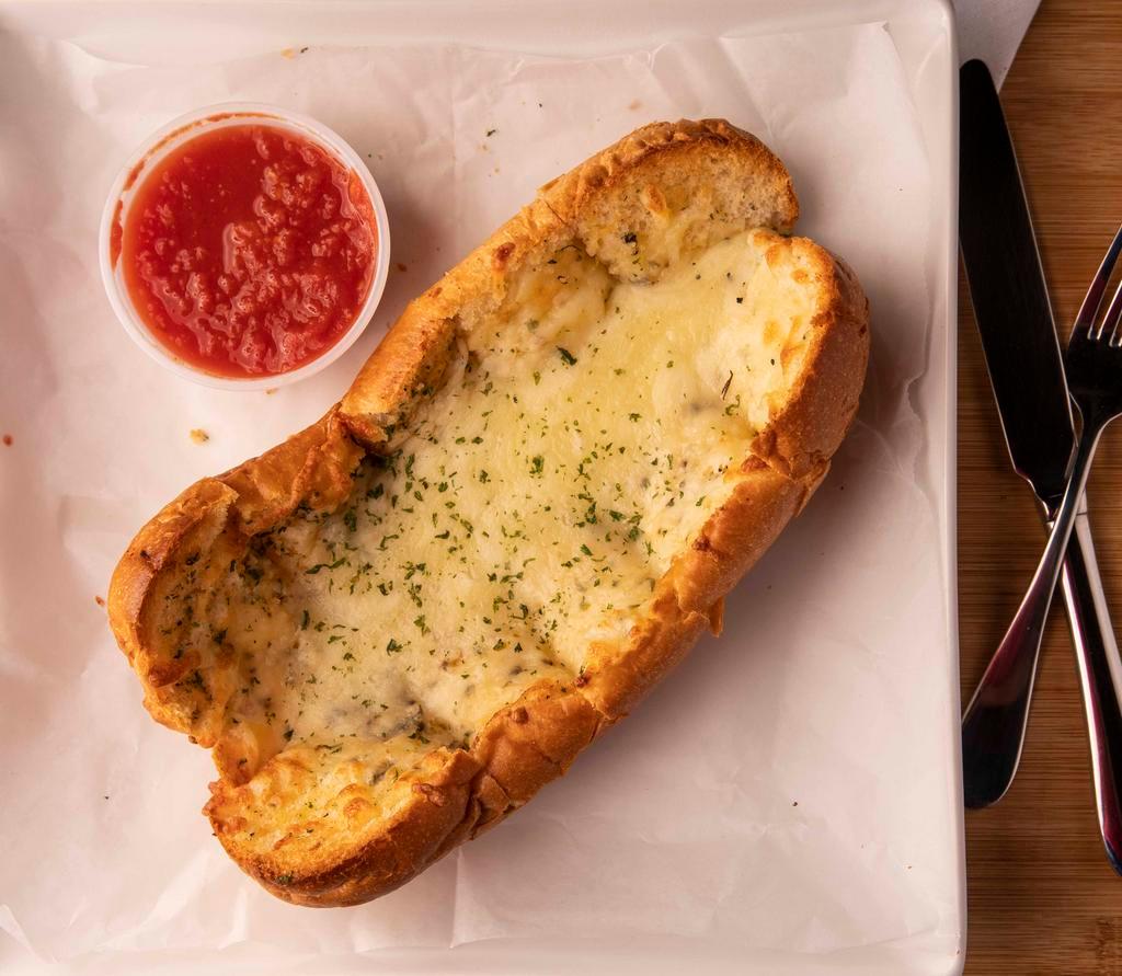 Cheesy Garlic Bread · Toasted garlic bread smothered with mozzarella cheese. Served with a side of marinara sauce.