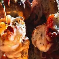 Meatball Sliders (4) · Made with our signature meatballs, marinara, Mozzarella, and our homemade garlic parmesan ro...