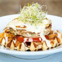Chicken & Waffle · House-ground chicken burger topped with tomato, one egg and spicy hollandaise served on a bu...
