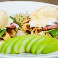 Eggs Benedict · Poached eggs, spinach and turkey bacon topped with housemade hollandaise on buttermilk waffle.