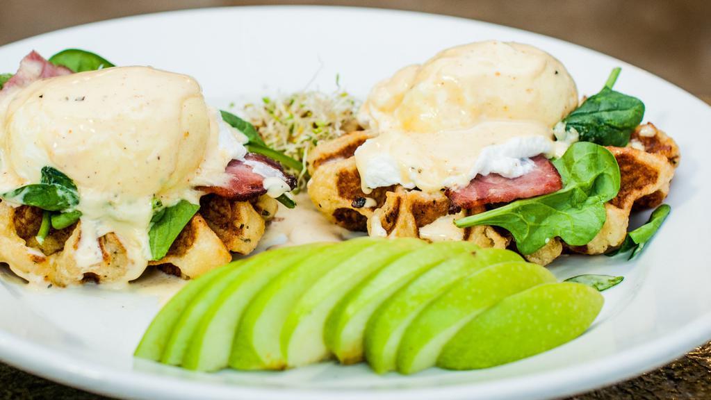 Eggs Benedict · Poached eggs, spinach and turkey bacon topped with housemade hollandaise on buttermilk waffle.