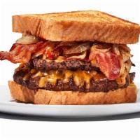 Twisted Texas Melt · 2 1/4 lb. patties. Yippee kai yay, hungry trucker! Beef meets caramelized onions, bacon, and...