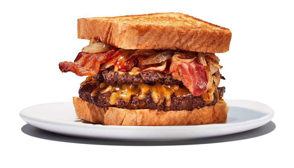 Twisted Texas Melt · 2 1/4 lb. patties. Yippee kai yay, hungry trucker! Beef meets caramelized onions, bacon, and cheddar cheese, fully loaded with a layer of our Daytona Beach® sauce and served on Texas toast.