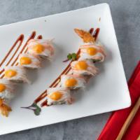 Pacific Roll · Crab meat over shrimp tempura roll with eel sauce and spicy mayo.