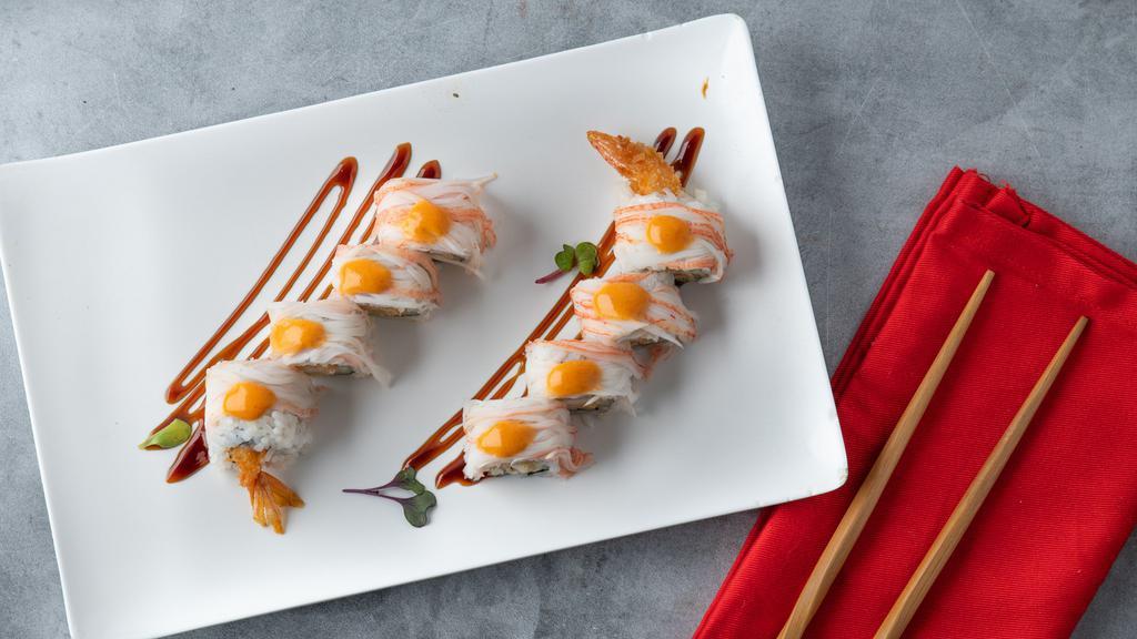 Pacific Roll · Crab meat over shrimp tempura roll with eel sauce and spicy mayo.