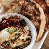 Local Goat Cheese Fondue · Good olive oil, greek olives, roasted tomatoes, grilled sourdough.