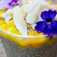 Chia-Colada · pitaya chia pudding, cocounut flakes mango, honey and hemp and amaranth mix.