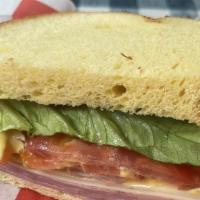 Honey Ham Hal · Thinly sliced ham, red onions, lettuce, tomato, muenster cheese, served on sourdough with ho...