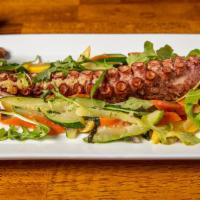 Polipo Alla Legna · Roasted octopus served with a julienne of squash, carrots, and zucchini mixed with seaweed s...