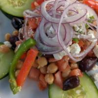 Contadina Salad · Cucumbers, chickpeas, black olives, red onions, red and green peppers, diced tomatoes, and f...
