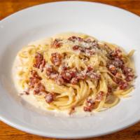 Linguini Alla Carbonara · Linguine pasta with Parmigiano-Reggiano and pecorino cheese, garlic, white wine, egg yolks a...