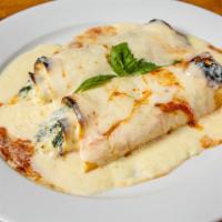 Cannelloni Di Spinaci · A pasta sheet, filled with spinach, Parmigiano-Reggiano, and ricotta cheese. Served in a bec...