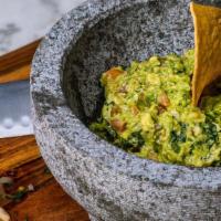 Traditional Guacamole  · Hass avocado, pico de gallo, cotija cheese