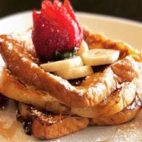 French Toast · Thick and fluffy pieces covered in fresh fruit and maple syrup.