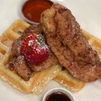 Chicken And Waffles · Fried chicken and waffles southern style with maple syrup