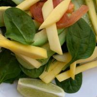 Spinach Salad · Generous Serving of Fresh Spinach, Fresh Sliced Mangos, Sliced Tomatoes, Sliced Avocado & Sl...