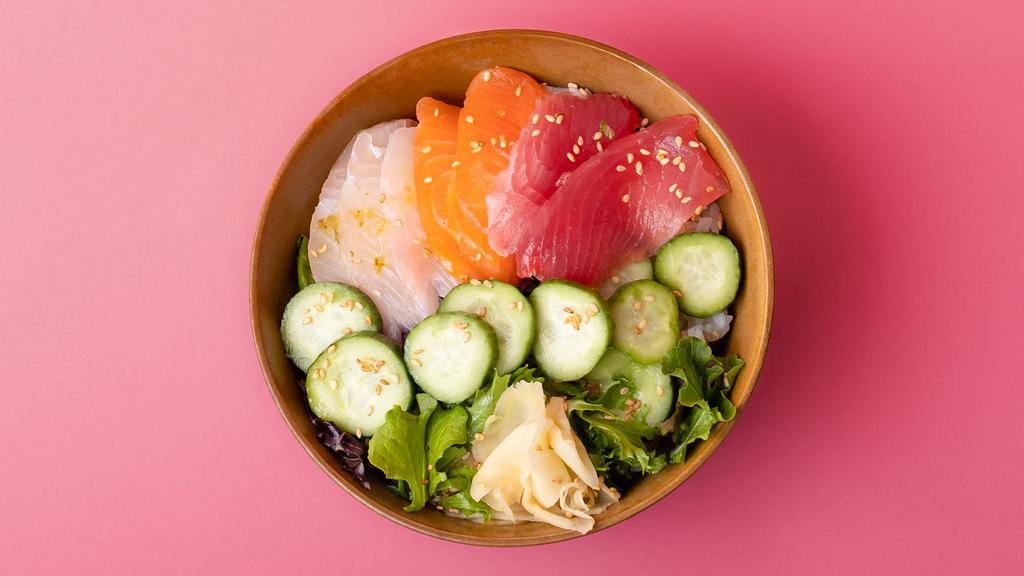 Chirashi Combo Rice Bowl · Freshly sliced tuna, salmon, and yellowtail sashimi over sushi rice with sliced cucumber, radish, ginger, crunchy greens, and sesame seeds.