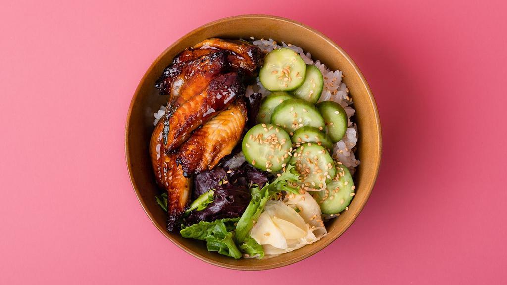 Unagi Rice Bowl · Smoked eel over sushi rice with sliced cucumber, radish, ginger, crunchy greens, and sesame seeds.