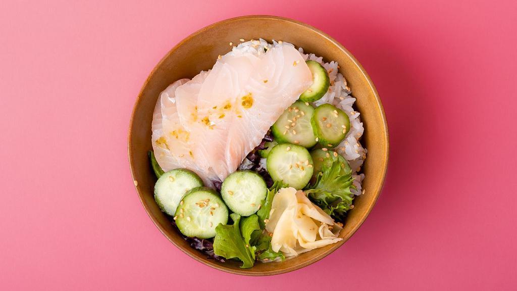 Yellowtail Rice Bowl · Freshly sliced yellowtail over sushi rice with sliced cucumber, radish, ginger, crunchy greens, and sesame seeds.