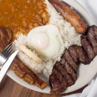 Bandeja Paisa · Typical colombian platter with rice, beans, pork skin, fried eggs, plantains, com cake and a...