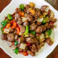 Stir Fried Beef Cube · Hot & spicy. Served with black pepper sauce. Served with steamed rice. Spicy.