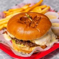 Hamburguesa · Homemade burger patty, tomatoes, romaine lettuce, onions, bacon, pineapple sauce, cheese, po...