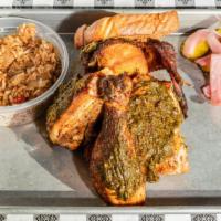 Half Chicken · 24-hour brined  and smoked,  topped with  collard pesto,