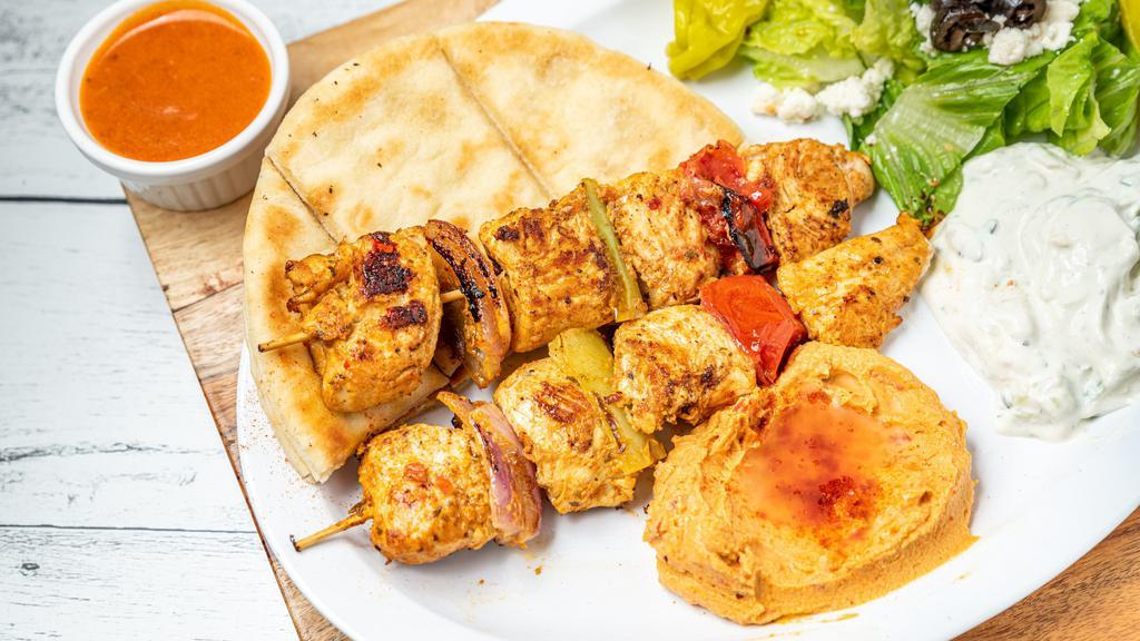  Chicken Kabob Tray · chicken kabob grilled, garden salad, hummus and pita, feeds min 10 people