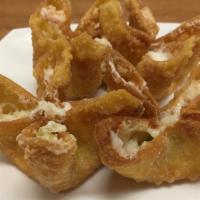 Ap13. Crab Rangoon · Six pieces. Crabmeat and cream cheese wrapped in an egg roll skin and served with sweet and ...