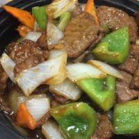 Pepper Steak · Beef, white onion and green bell pepper. Served with your choice of rice.