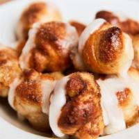 Cinnamon Knots · Our homemade dough knots with butter and sprinkled sugar and cinnamon. Topped with icing.