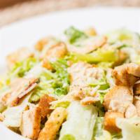 Chicken Caesar Salad · Crisp romaine lettuce with shredded parmesan cheese, grilled chicken, and croutons. Served w...