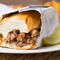 Philly Cheesesteak · Sliced ribeye with sautéed onions and your choice of cheez whiz or white American cheese.