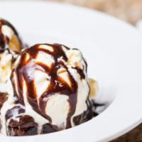 Brownie Mogul · Hot chocolate brownie with vanilla ice cream and chocolate syrup.